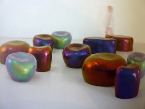 Ciottolo-iridescent-stools-by-Il-Laboratorio-dellimperfetto-are-made-by-tranforming-fiberglass-hand-sanding-painting-and-polishing.-Made-from-the-same-mold-each-piece-becomes-unique-thr